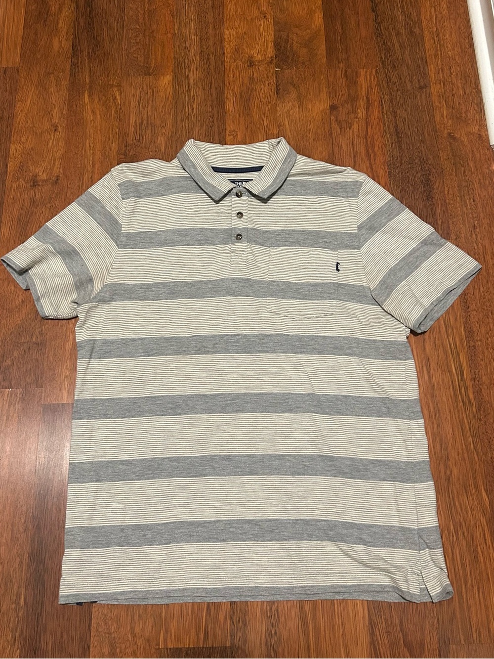 Striped North Face polo shirt